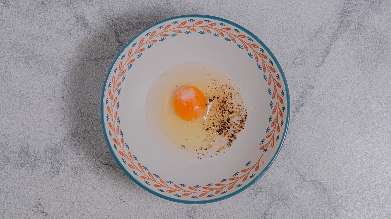 Egg and water mixture in a bowl prepared as coating for baked avocado fries